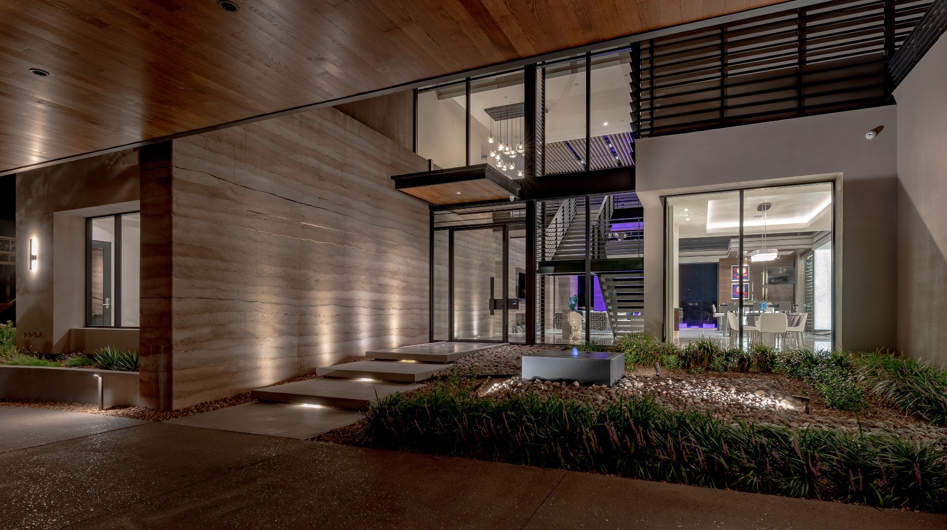 Structural rammed earth residence by DCI
